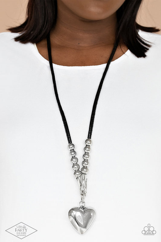 Paparazzi Forbidden Love - Black Necklace - Black Pendant Necklace Chunky silver beads, a silver heart pendant swings from a silver hook-like fittings that attach to a bold leather cord across the chest for a heartbreaker look.  Sold as one individual black pendant necklace.