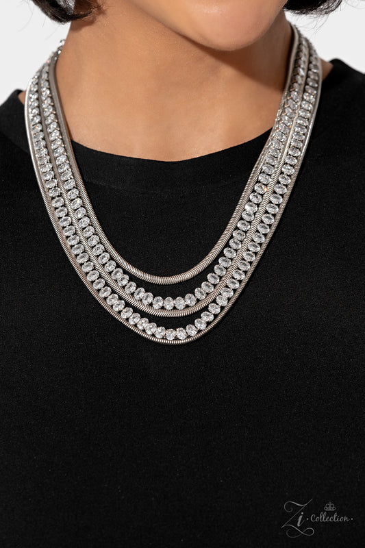Flat silver snake chains alternate with explosive rows of sparkling white rhinestones in this 2023 Zi Collection piece from Paparazzi Accessories. Features an adjustable clasp closure and includes matching earrings from A Finishing Touch Jewelry