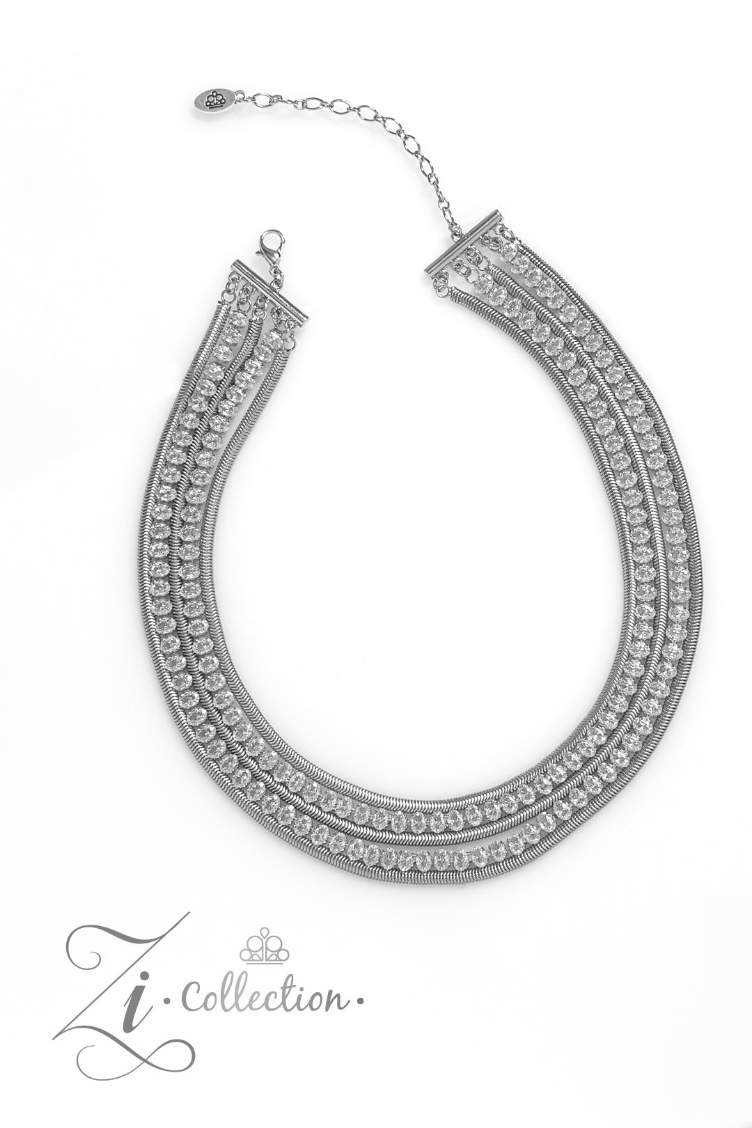 Flat silver snake chains alternate with explosive rows of sparkling white rhinestones in this 2023 Zi Collection piece from Paparazzi Accessories. Features an adjustable clasp closure and includes matching earrings from A Finishing Touch Jewelry