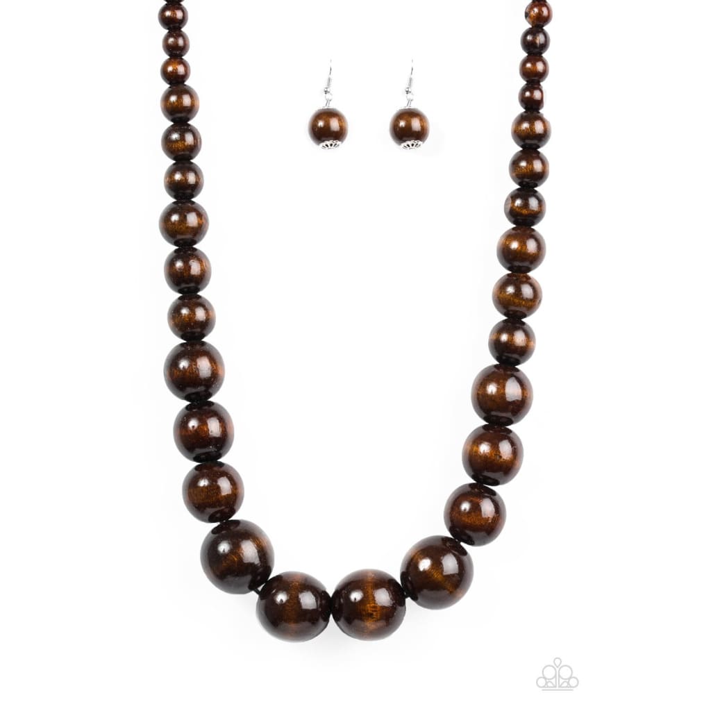 Paparazzi Effortlessly Everglades - Brown Necklace  Gradually increasing in size near the center, earthy wooden beads are threaded along a brown string for a summery look. Features an adjustable sliding knot closure.  Sold as one individual necklace. Includes one pair of matching earrings.  Paparazzi Accessories are all Lead Free and Nickel Free