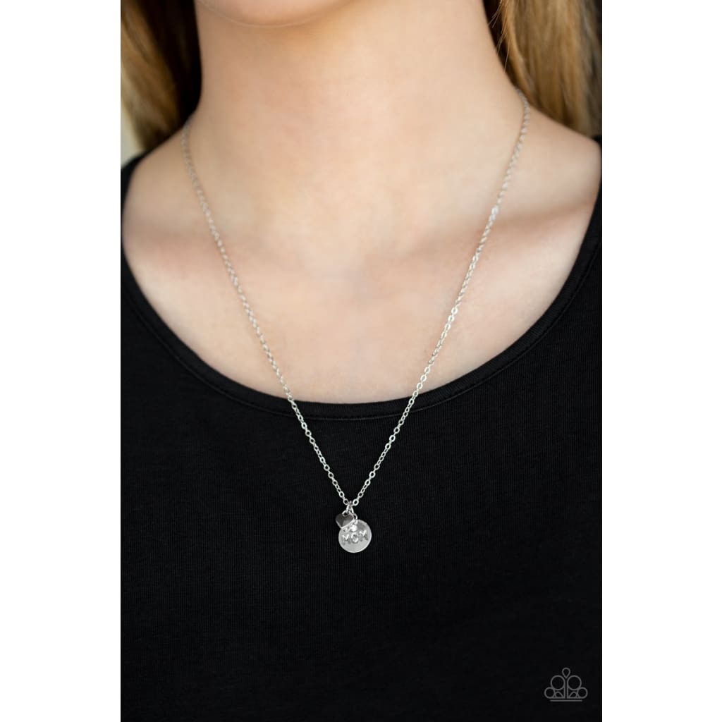 Paparazzi Mom Boss - Dainty Silver Neckclace - Fashion Plug Cluster of hematite rhinestones, a silver disc with the inspirational phrase, "Mom Boss". Sold as one individual Dainty Silver necklace. Includes one pair of matching earrings. Free shipping on orders over $75